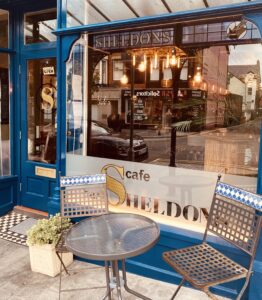 A table for two outside Sheldon's wine bar during the day